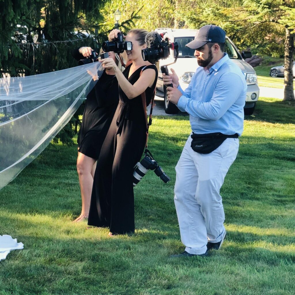 photo of photographers taking photos of bride